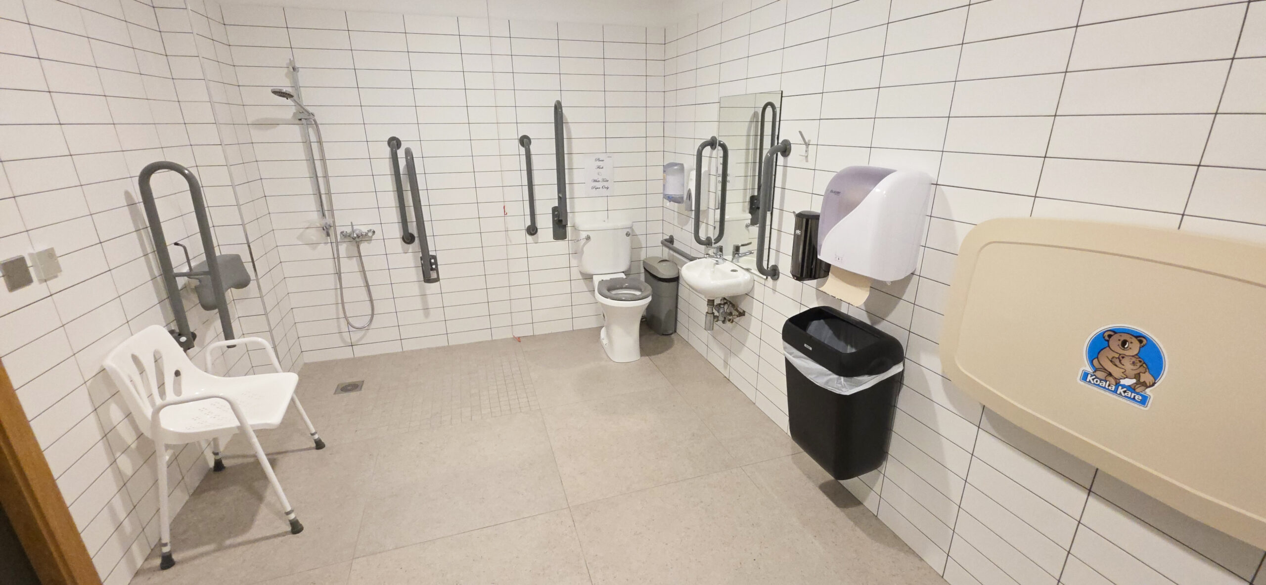 Complete view of the accessible toilet facilities with safety equipment