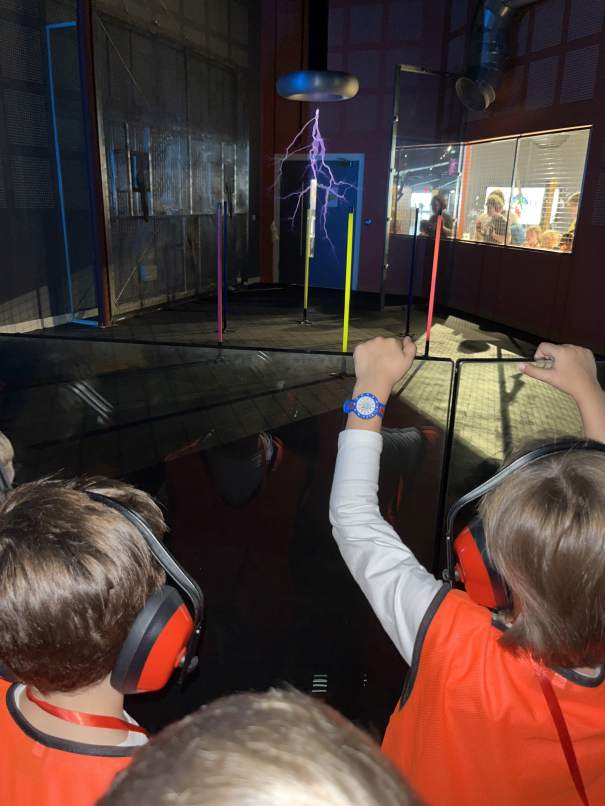 Campers watching an electrifying lightning demonstration during the science show
